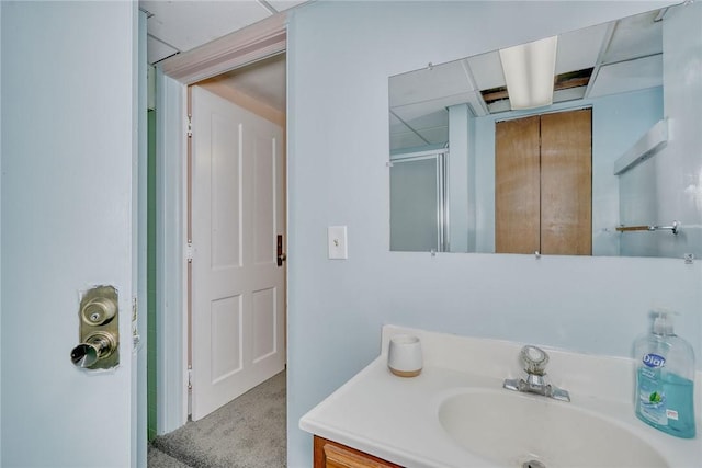 bathroom featuring vanity and a shower with shower door