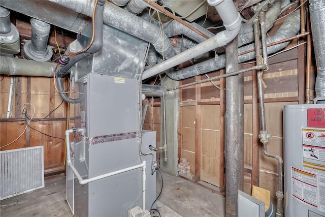 utility room with gas water heater and heating unit