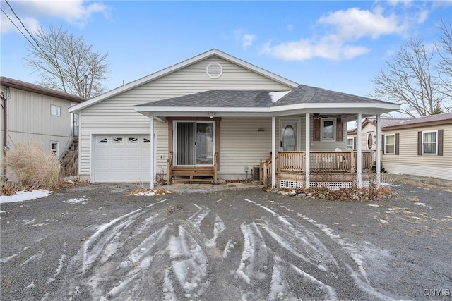 view of front of home featuring a garage and a porch