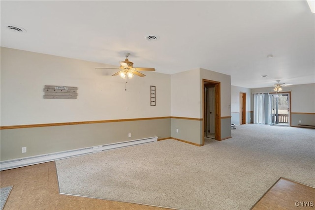 empty room featuring ceiling fan, baseboard heating, and carpet flooring