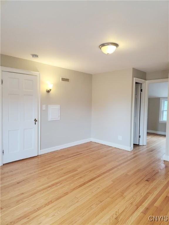 unfurnished room featuring light hardwood / wood-style flooring