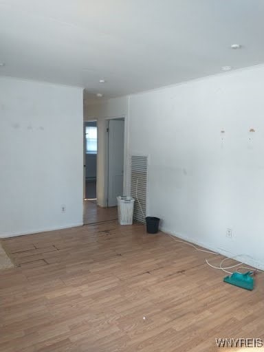 spare room featuring light hardwood / wood-style floors