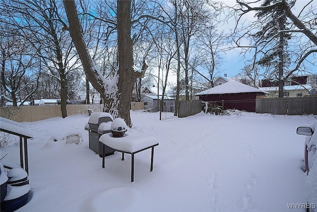 view of yard layered in snow