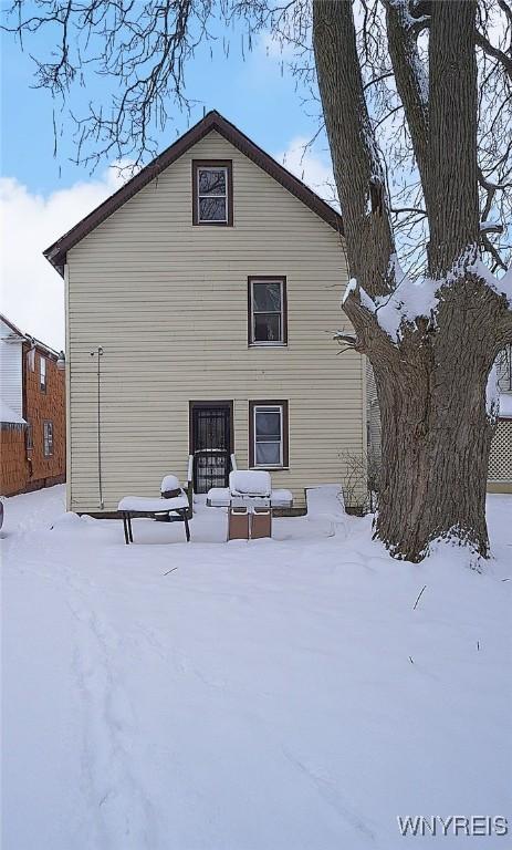 view of snow covered house