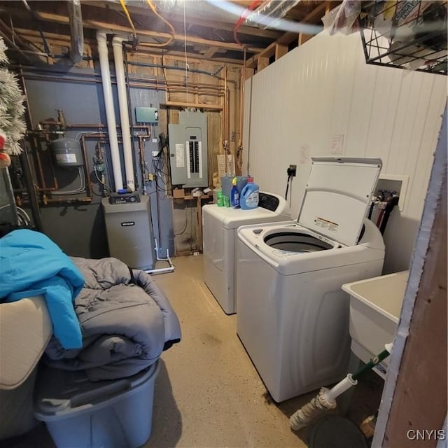 laundry room with separate washer and dryer, sink, and electric panel