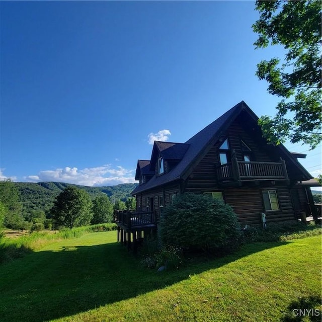 view of side of home featuring a yard