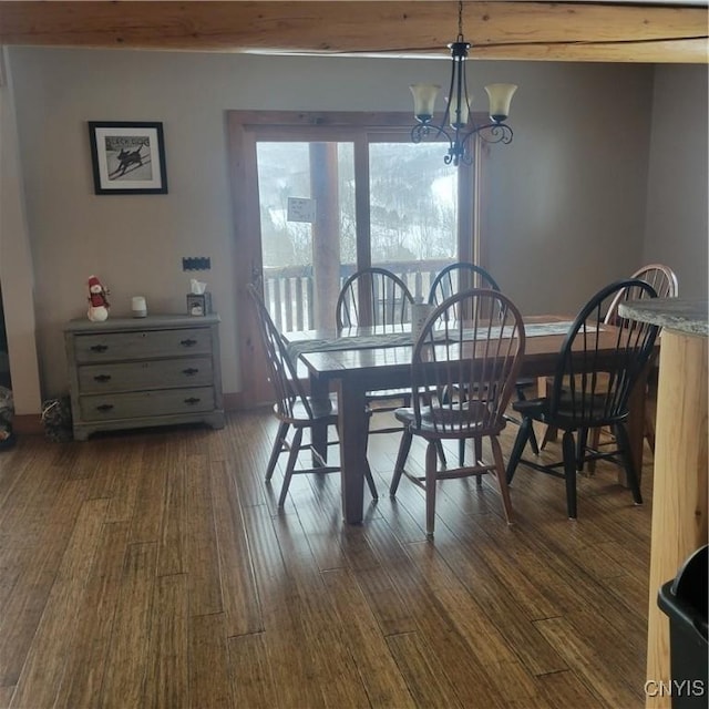 dining area featuring beam ceiling, dark hardwood / wood-style floors, and a notable chandelier