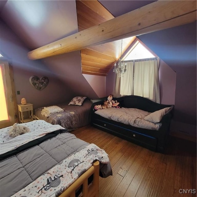 bedroom with a chandelier, lofted ceiling with beams, and light wood-type flooring