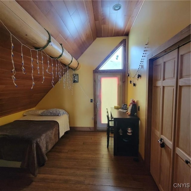 bedroom featuring dark hardwood / wood-style flooring, vaulted ceiling, a closet, and wooden ceiling