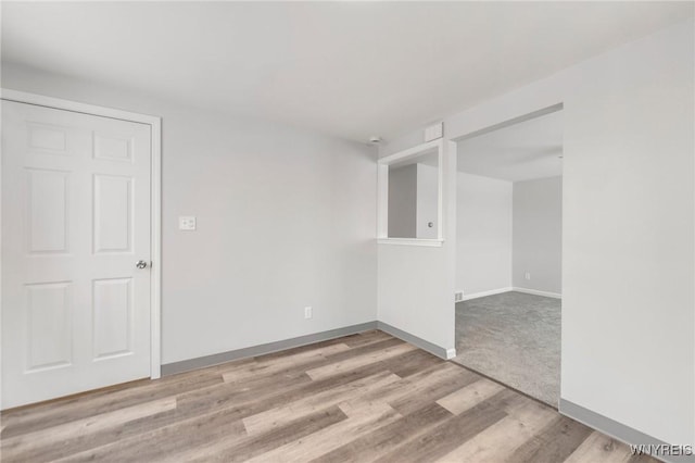 spare room featuring light hardwood / wood-style floors