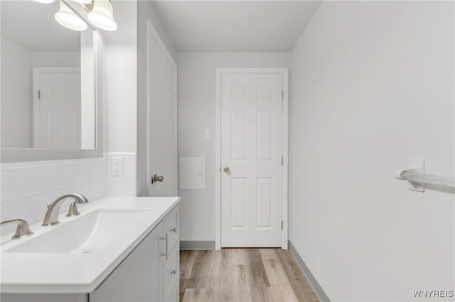 bathroom featuring hardwood / wood-style floors and vanity