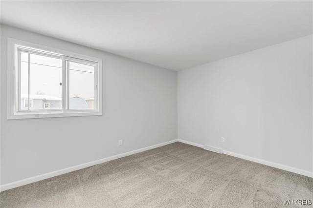 empty room featuring carpet flooring