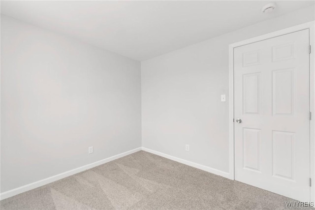 empty room featuring carpet flooring