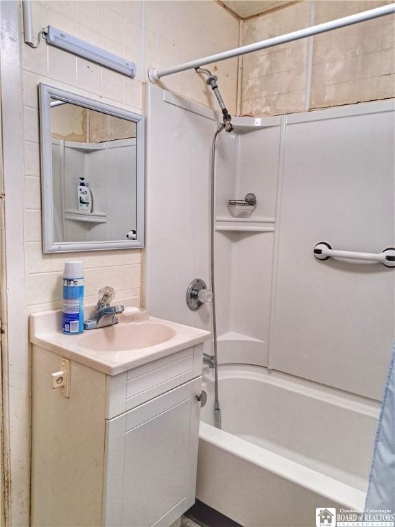 bathroom with decorative backsplash, vanity, and shower / bathtub combination with curtain