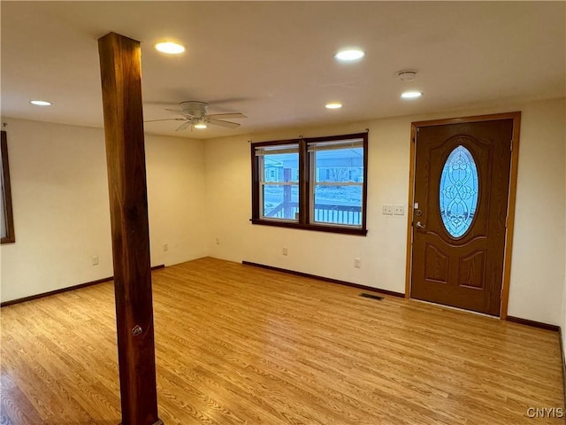 entrance foyer with ceiling fan and light hardwood / wood-style flooring