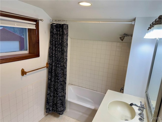 bathroom featuring tile patterned floors, vanity, and shower / bath combination with curtain