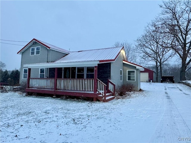 view of front facade with an outbuilding and a garage