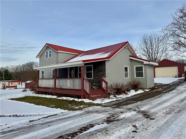 view of front facade with an outbuilding and a garage