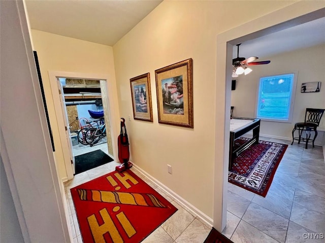 corridor with light tile patterned flooring