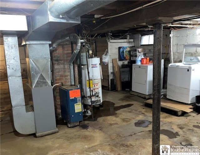 basement with washing machine and dryer and water heater