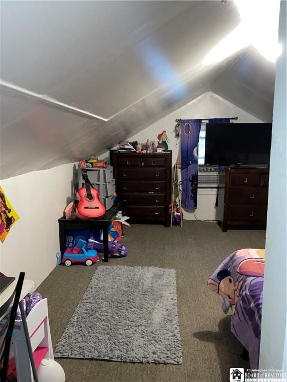 bedroom featuring carpet flooring and vaulted ceiling