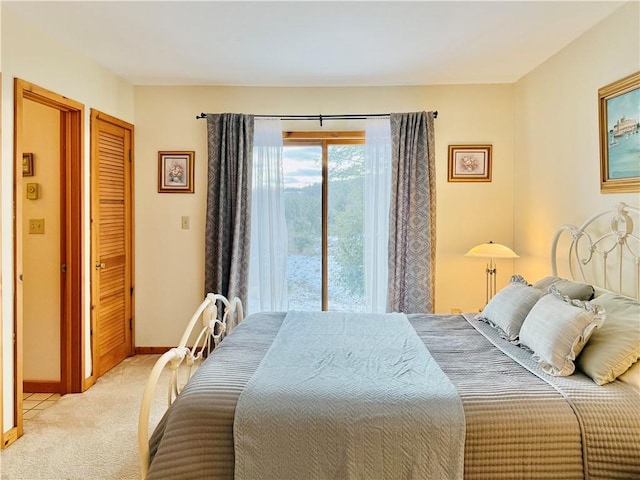 bedroom featuring light colored carpet