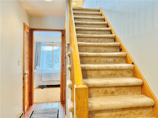 stairs featuring tile patterned floors