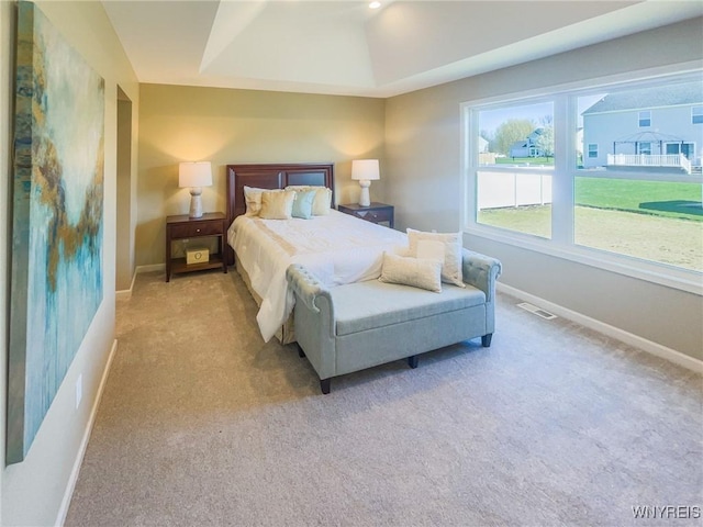 bedroom featuring light carpet