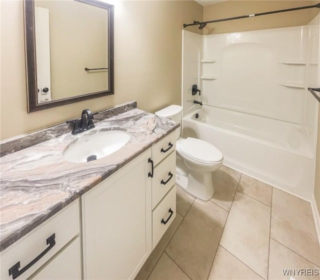 full bathroom with tile patterned flooring, vanity,  shower combination, and toilet