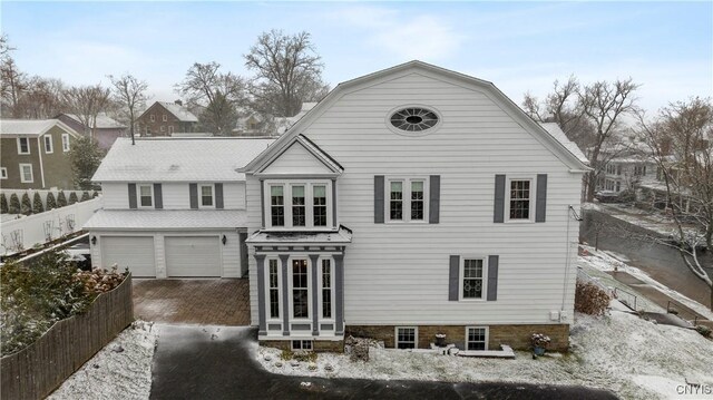 back of house featuring a garage