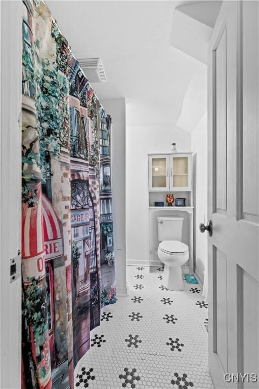 bathroom featuring tile patterned floors and toilet