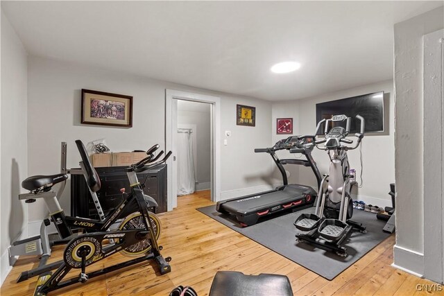 workout area featuring hardwood / wood-style flooring