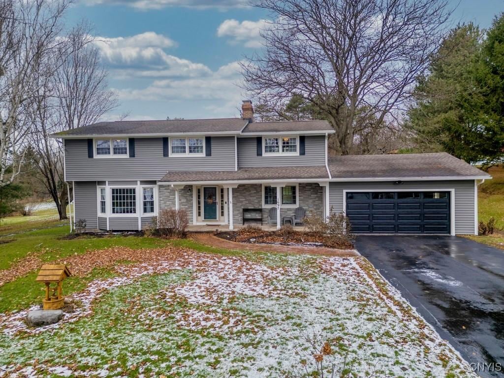 view of front property featuring a front yard and a garage