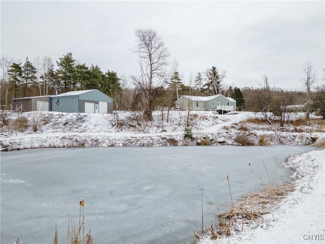 yard layered in snow featuring an outdoor structure