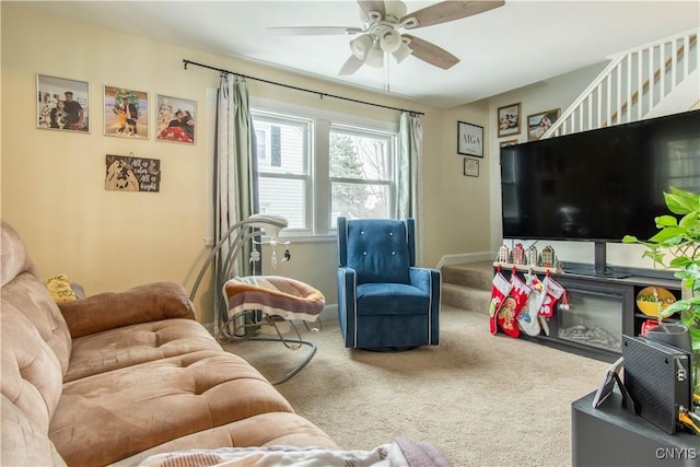 living room with carpet floors and ceiling fan