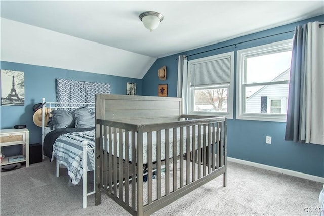 carpeted bedroom with lofted ceiling