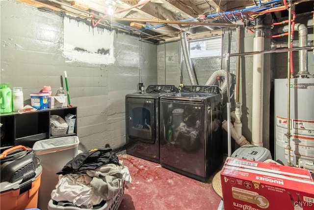 laundry room with water heater and independent washer and dryer