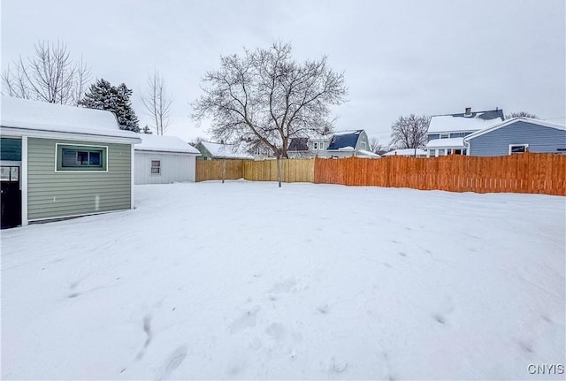 view of yard layered in snow