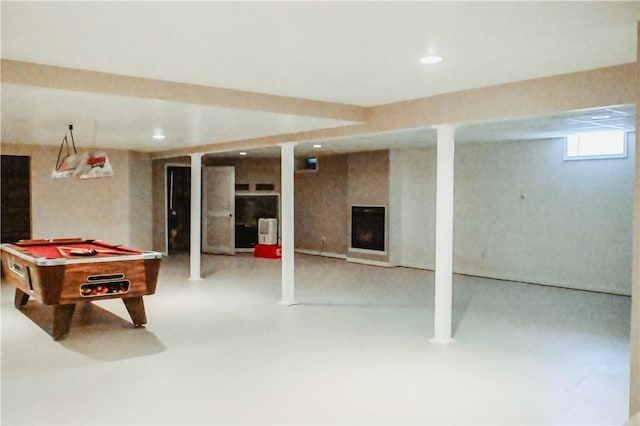 recreation room featuring concrete flooring, recessed lighting, pool table, and a fireplace