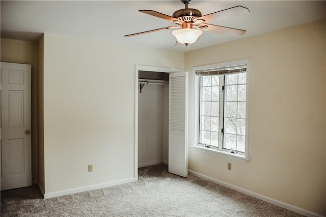 unfurnished bedroom with a ceiling fan, a closet, carpet flooring, and baseboards