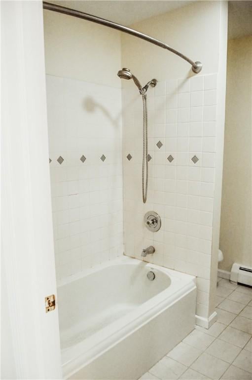 full bath with shower / washtub combination, toilet, and tile patterned floors