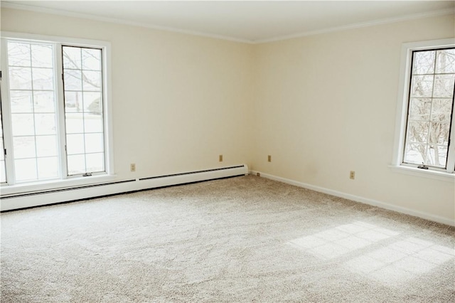 carpeted empty room featuring a baseboard heating unit, plenty of natural light, and crown molding