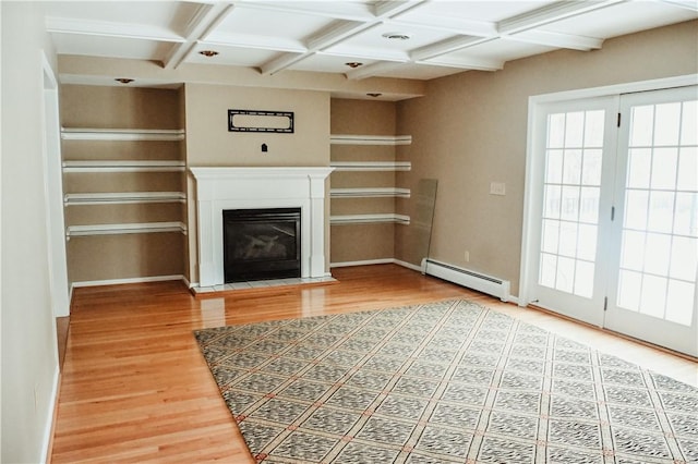 unfurnished living room featuring coffered ceiling, a fireplace with flush hearth, wood finished floors, beamed ceiling, and baseboard heating