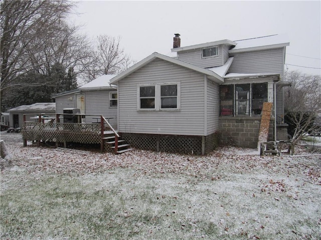 back of property featuring a deck