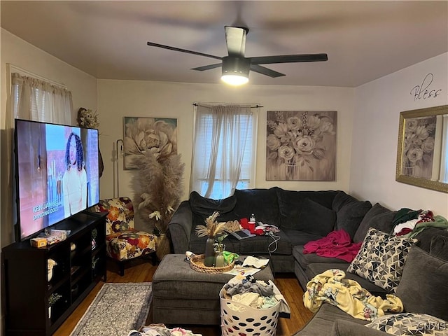 living room with ceiling fan and dark hardwood / wood-style floors