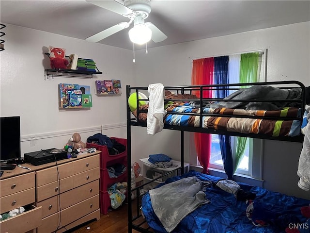 bedroom featuring ceiling fan and wood-type flooring