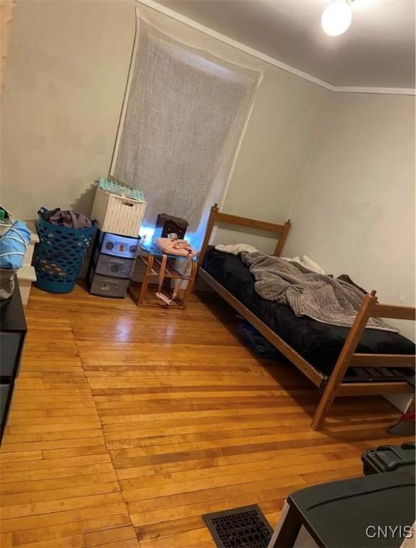 bedroom with light wood-type flooring