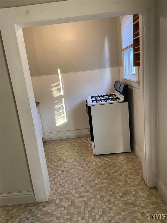 kitchen with white range with gas stovetop