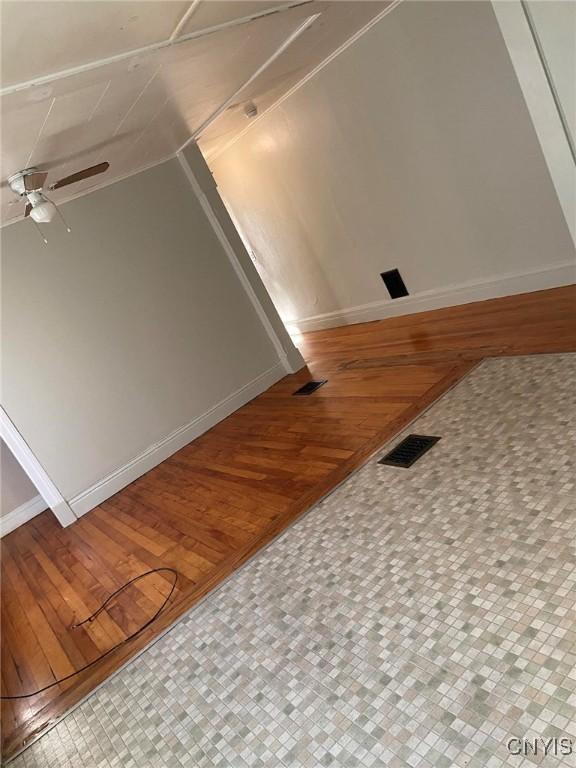 interior details with ceiling fan and wood-type flooring