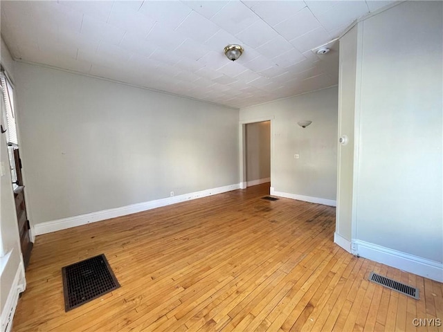 empty room with light hardwood / wood-style floors